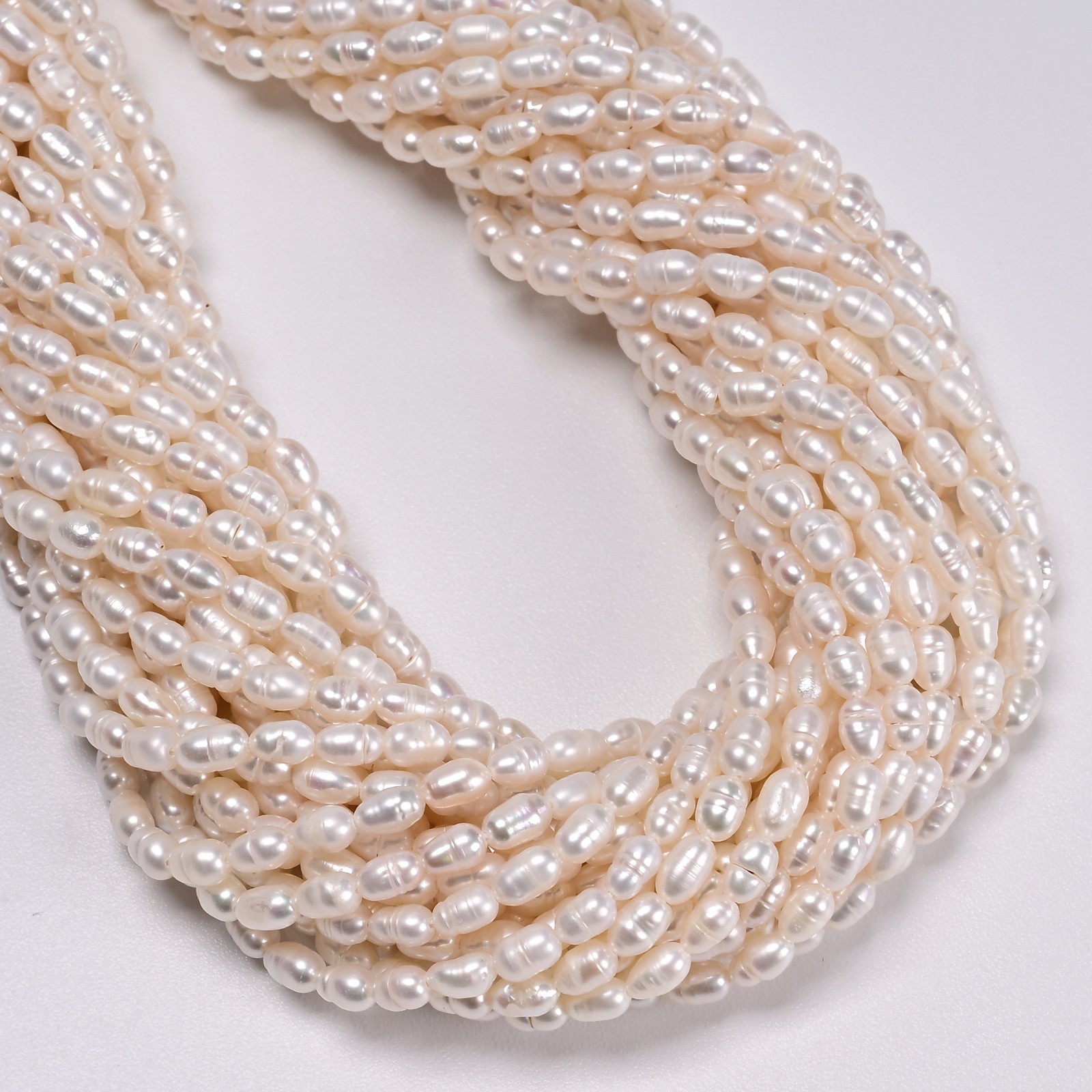 White Fresh Water Pearl Rice Shape Beads Size 4x5mm 14” Strand