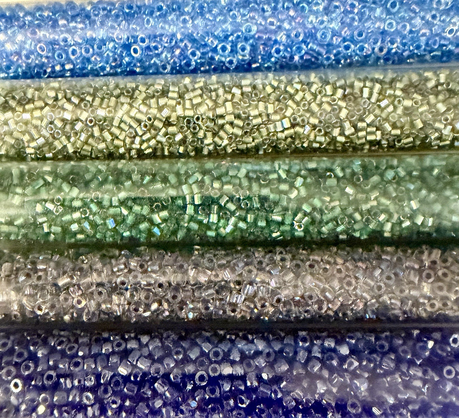 Collection of 11 Tubes of Assorted Metallic Seed Beads