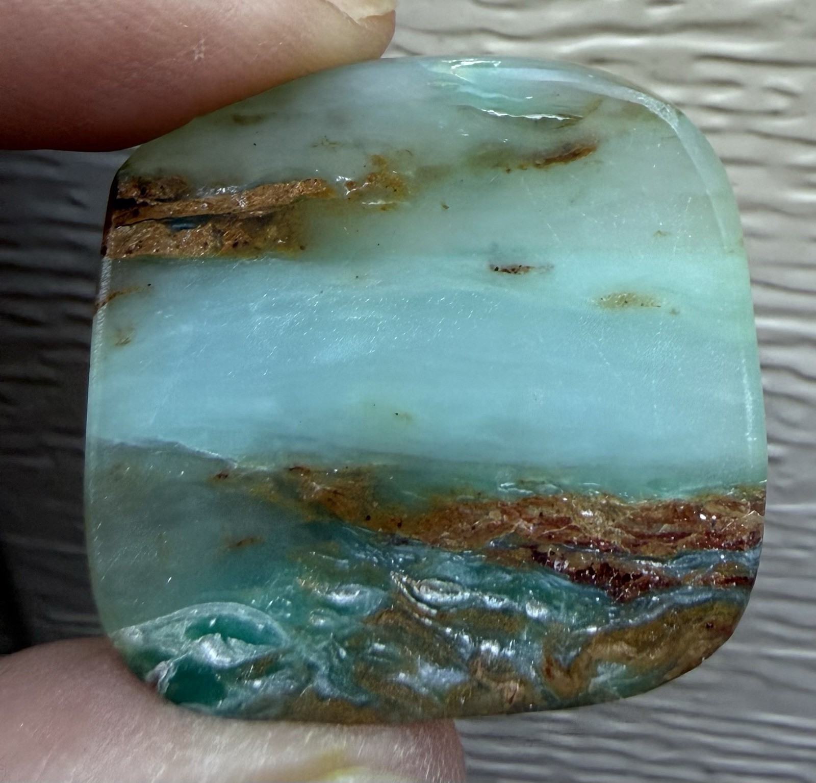 Peruvian Opal Cabochon. 1 1/4” x 1 3/16” x 1/4”, 0.3 oz. Polished all sides.