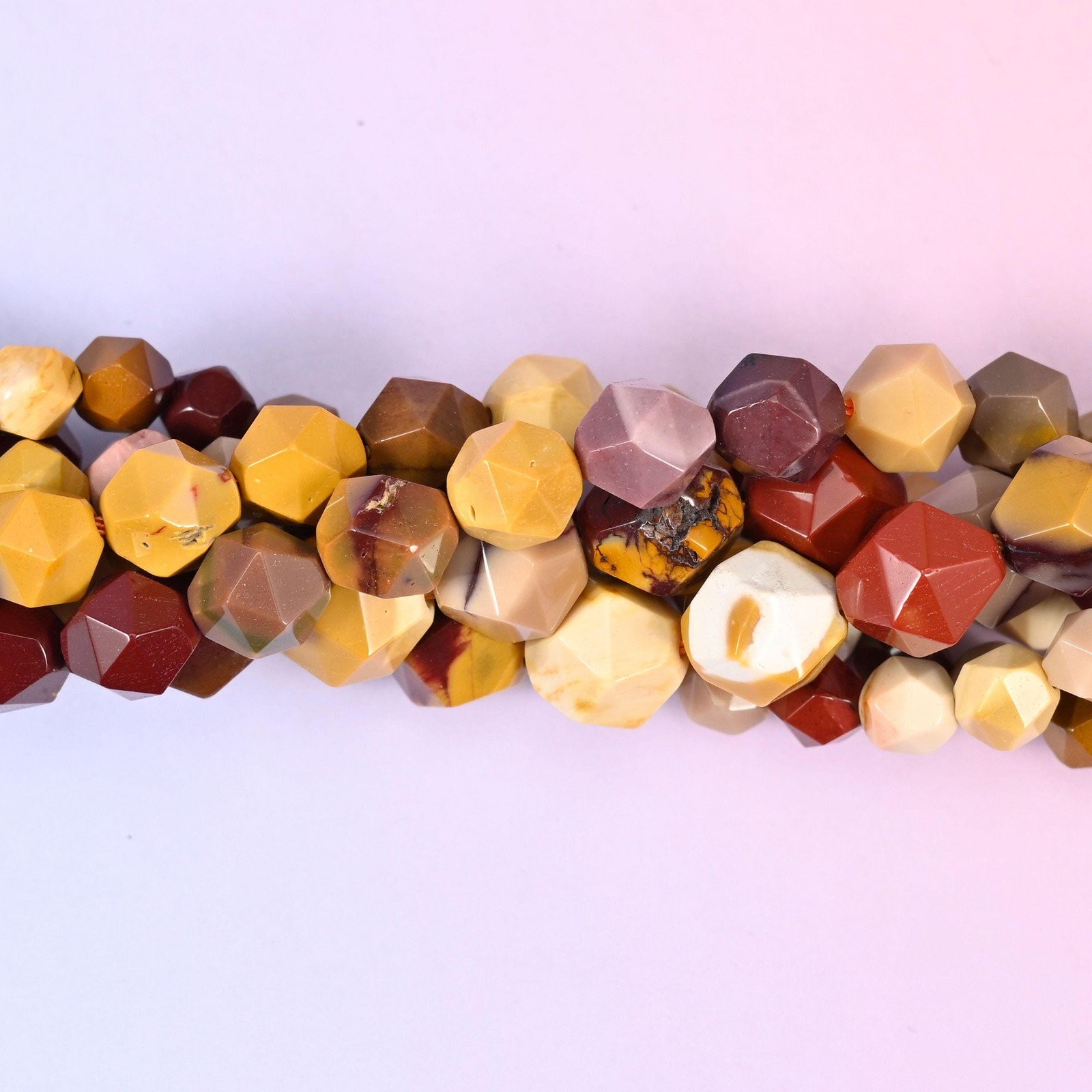 Mookaite Jasper Beads: Faceted Diamond Star Cut, 6-10mm, 15.5 inch Strand