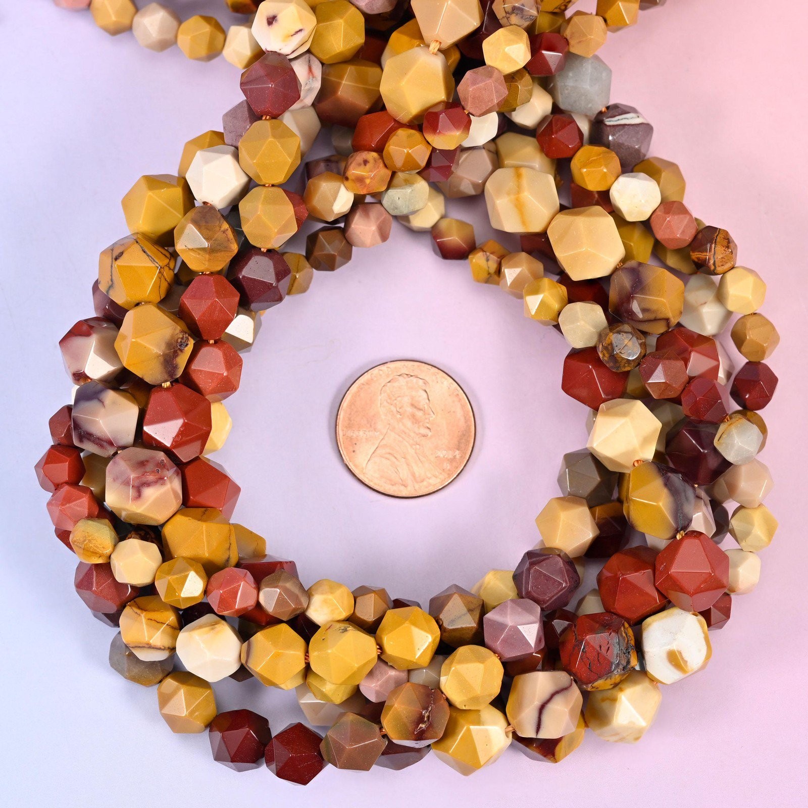 Mookaite Jasper Beads: Faceted Diamond Star Cut, 6-10mm, 15.5 inch Strand