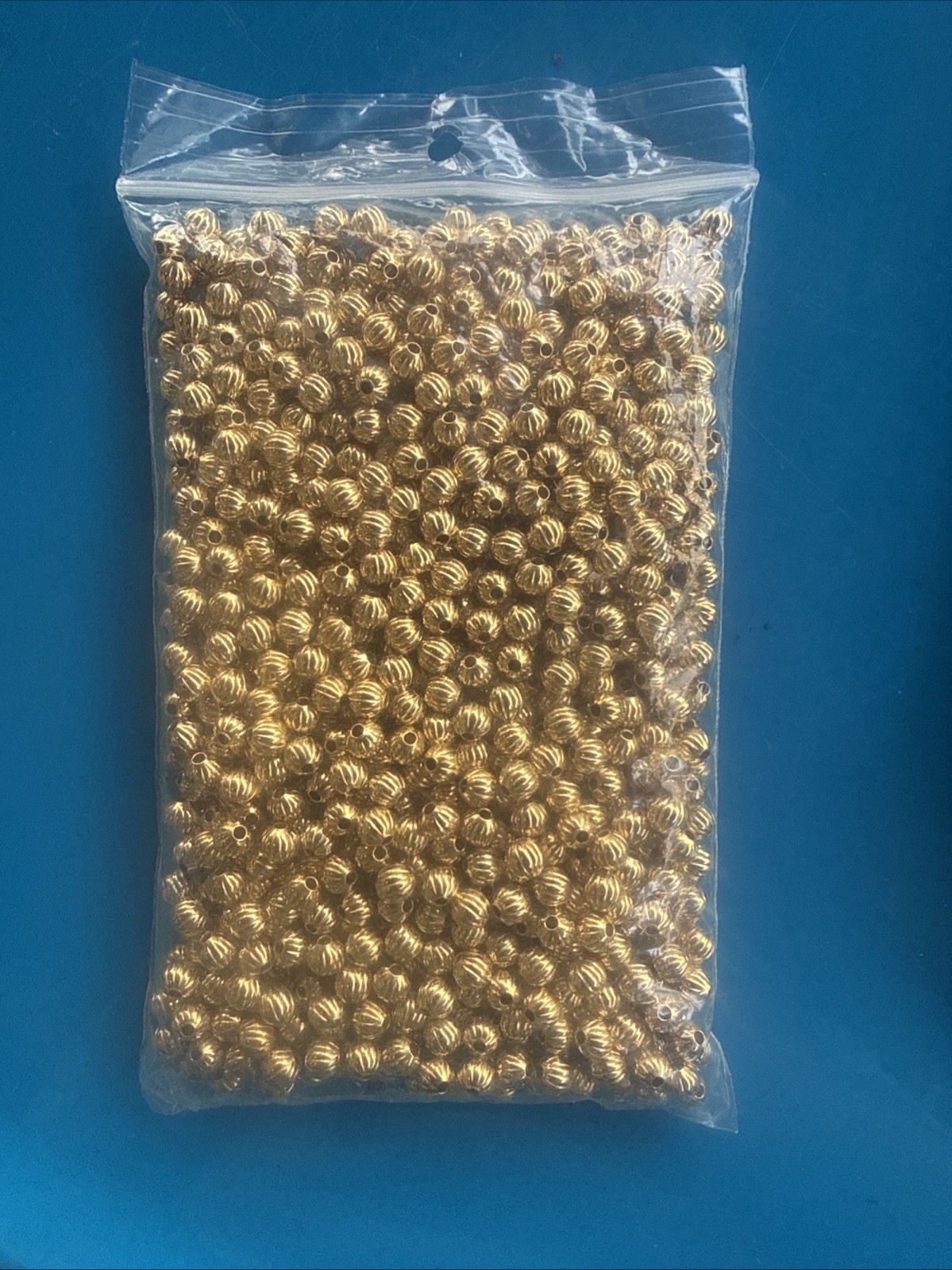 Fire mountain gems Bead 1pkg1000 gold-plated, 6mm corrugated round, brass