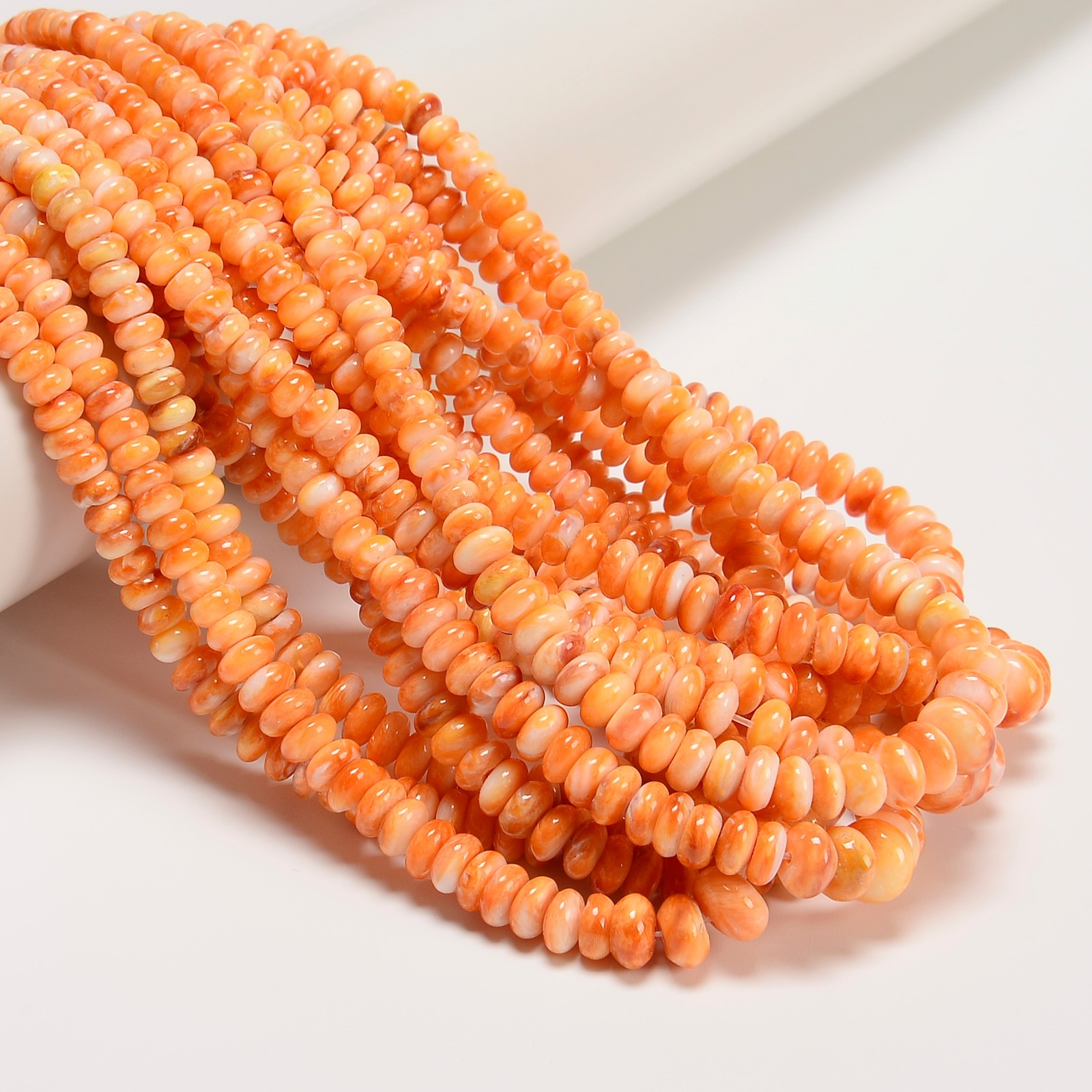 Graduated Light Orange Spiny Oyster Smooth Rondelle Beads 2-5×4-8mm 16″ Strand