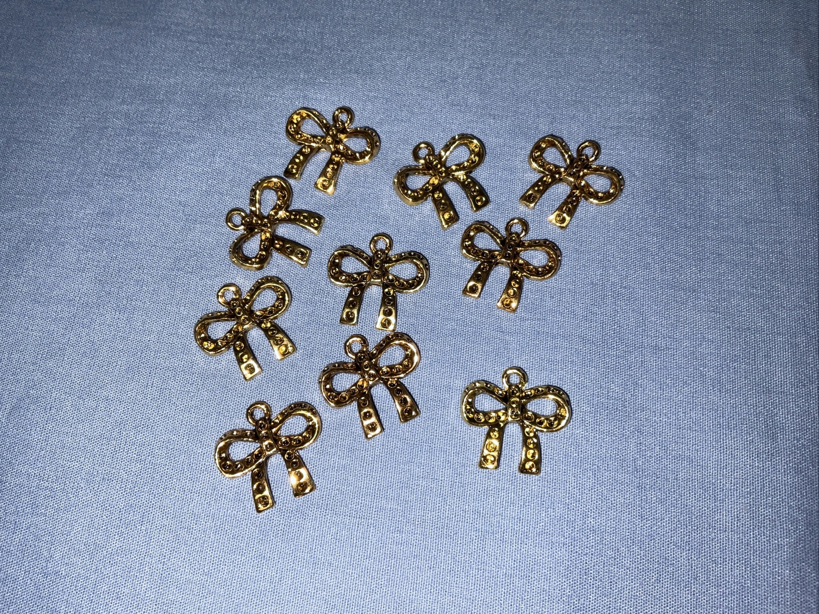 Fire Mountain Gems Discontinued Craft Gold Tone Bow Charms Lot of 50 (709)