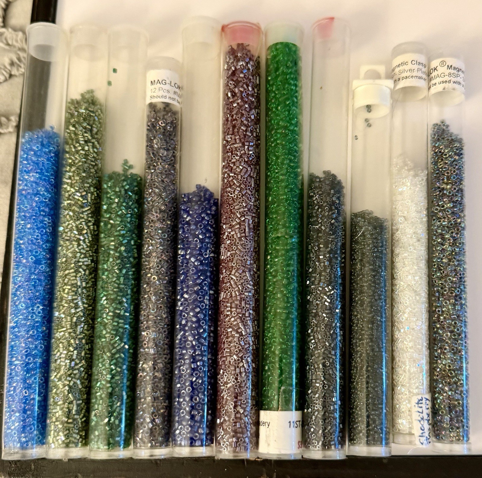Collection of 11 Tubes of Assorted Metallic Seed Beads