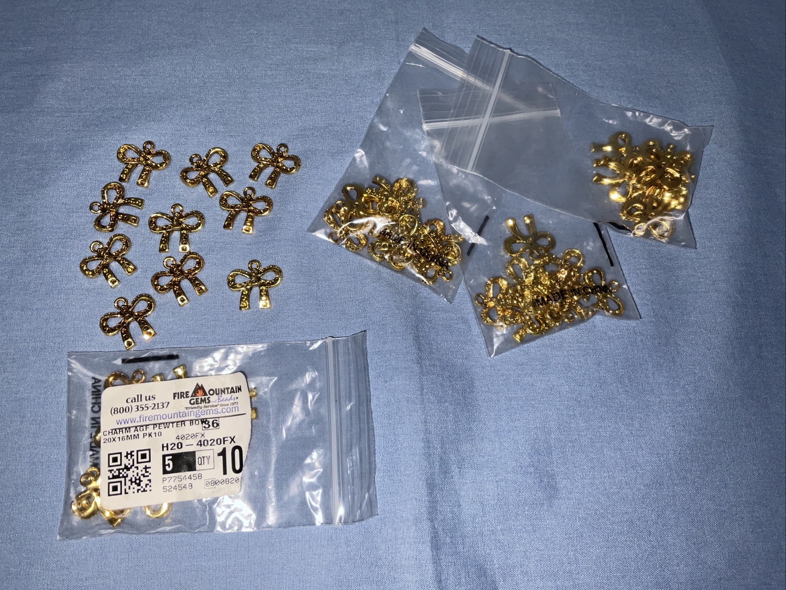 Fire Mountain Gems Discontinued Craft Gold Tone Bow Charms Lot of 50 (709)