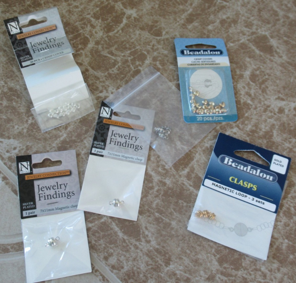 SMALL LOT OF JEWELRY MAKING SUPPLIES – PRE OWNED- WIRE, CLASPS, COVERS