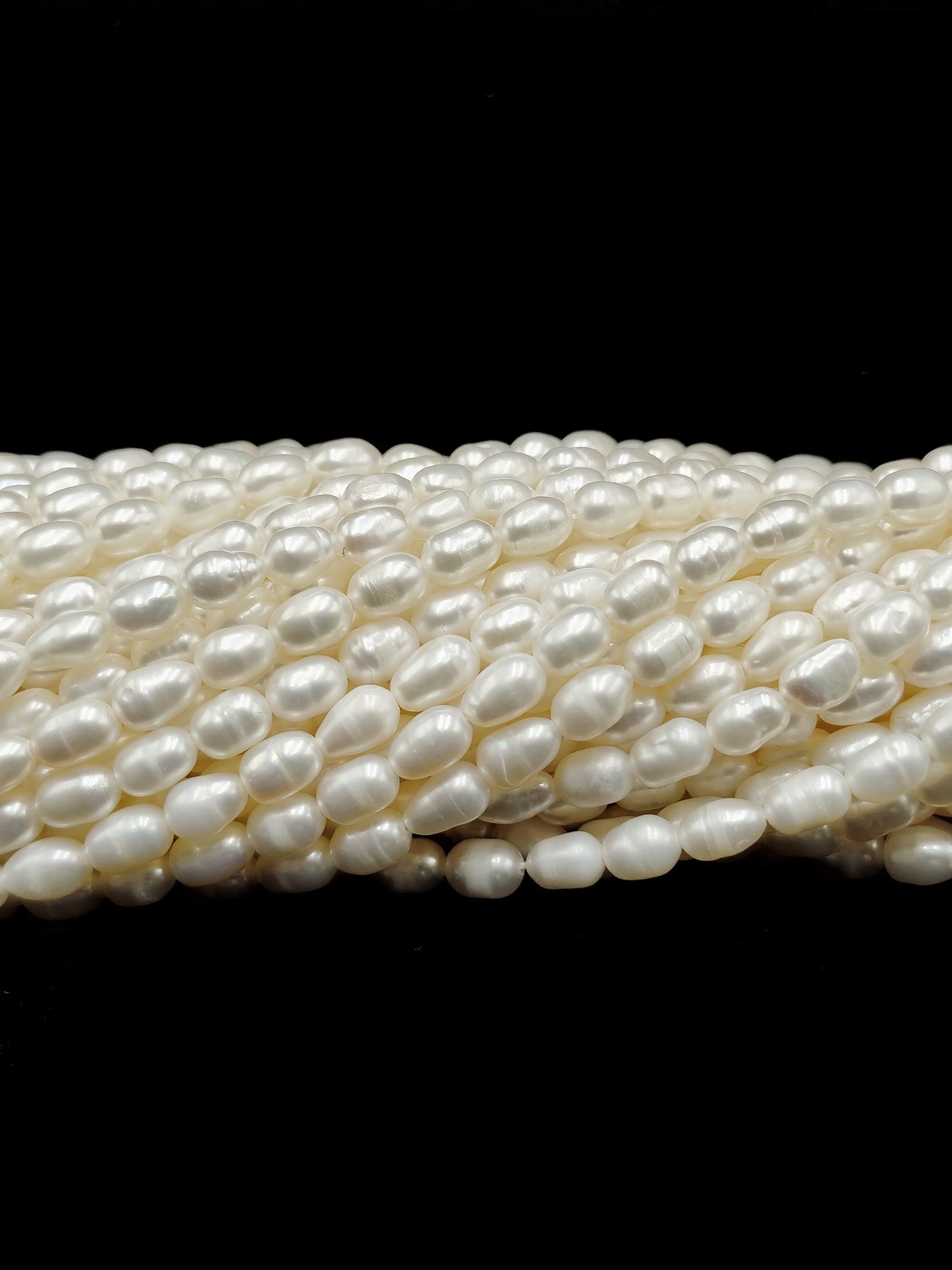 White Fresh Water Pearl Rice Shape Beads Size 4x6mm 14” Strand