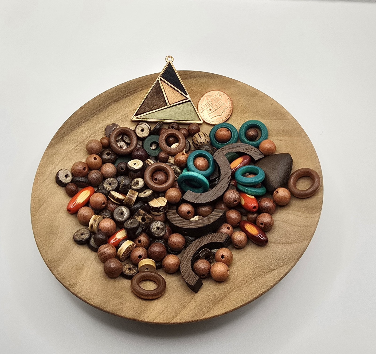 Variety Of Wood Beads And Rings Including A Pendant, Previously Owned But Unused