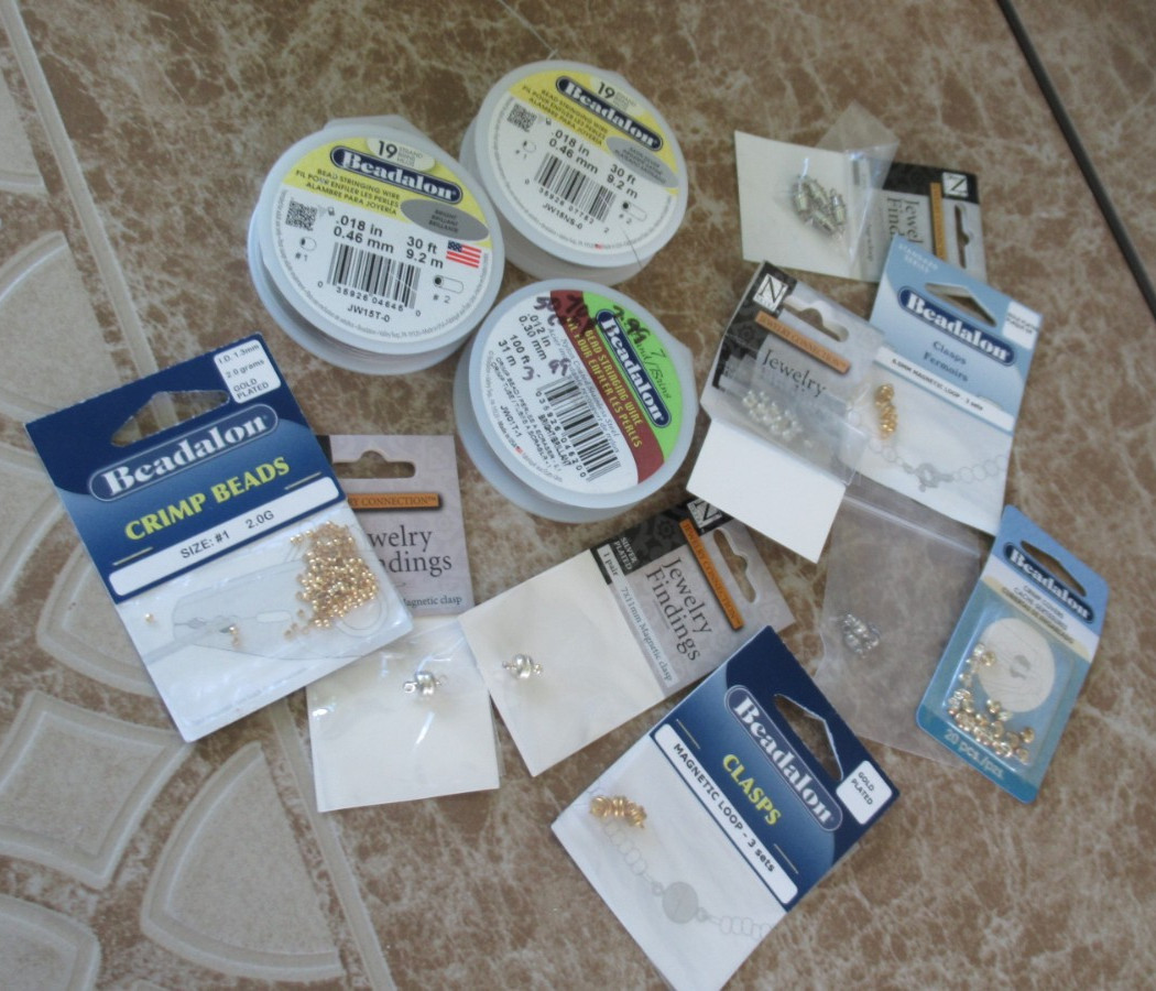 SMALL LOT OF JEWELRY MAKING SUPPLIES – PRE OWNED- WIRE, CLASPS, COVERS