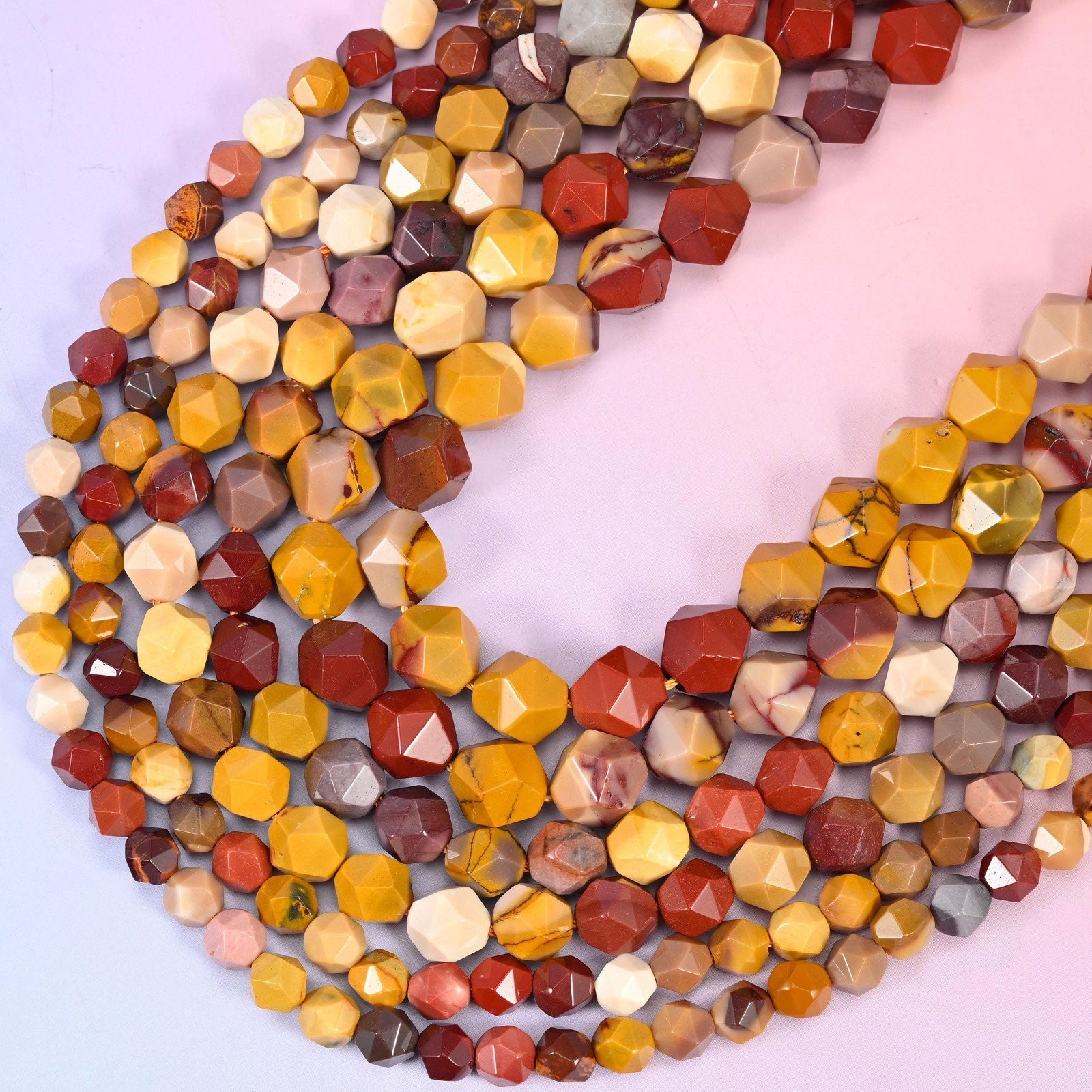 Mookaite Jasper Beads: Faceted Diamond Star Cut, 6-10mm, 15.5 inch Strand