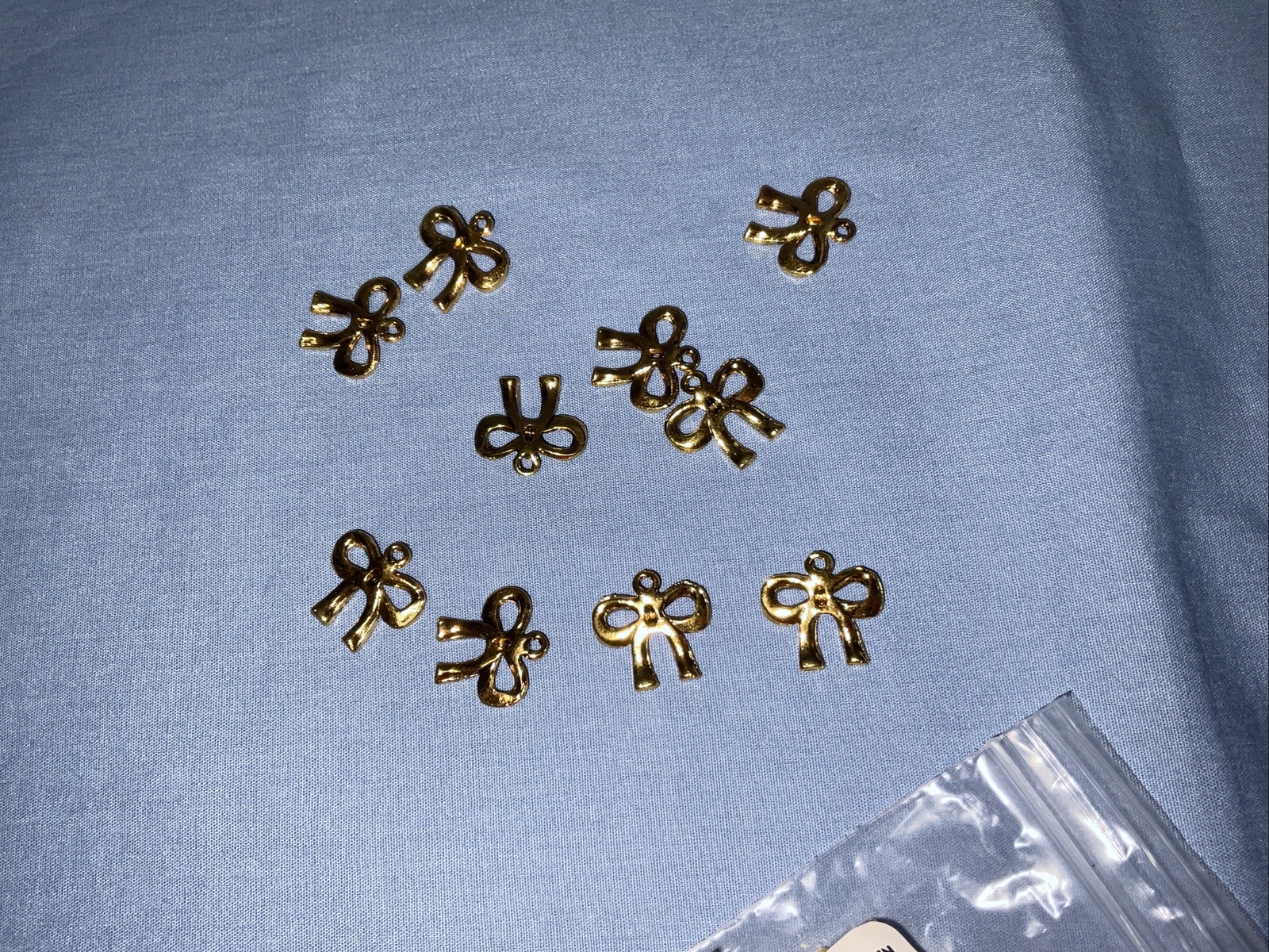 Fire Mountain Gems Discontinued Craft Gold Tone Bow Charms Lot of 50 (709)