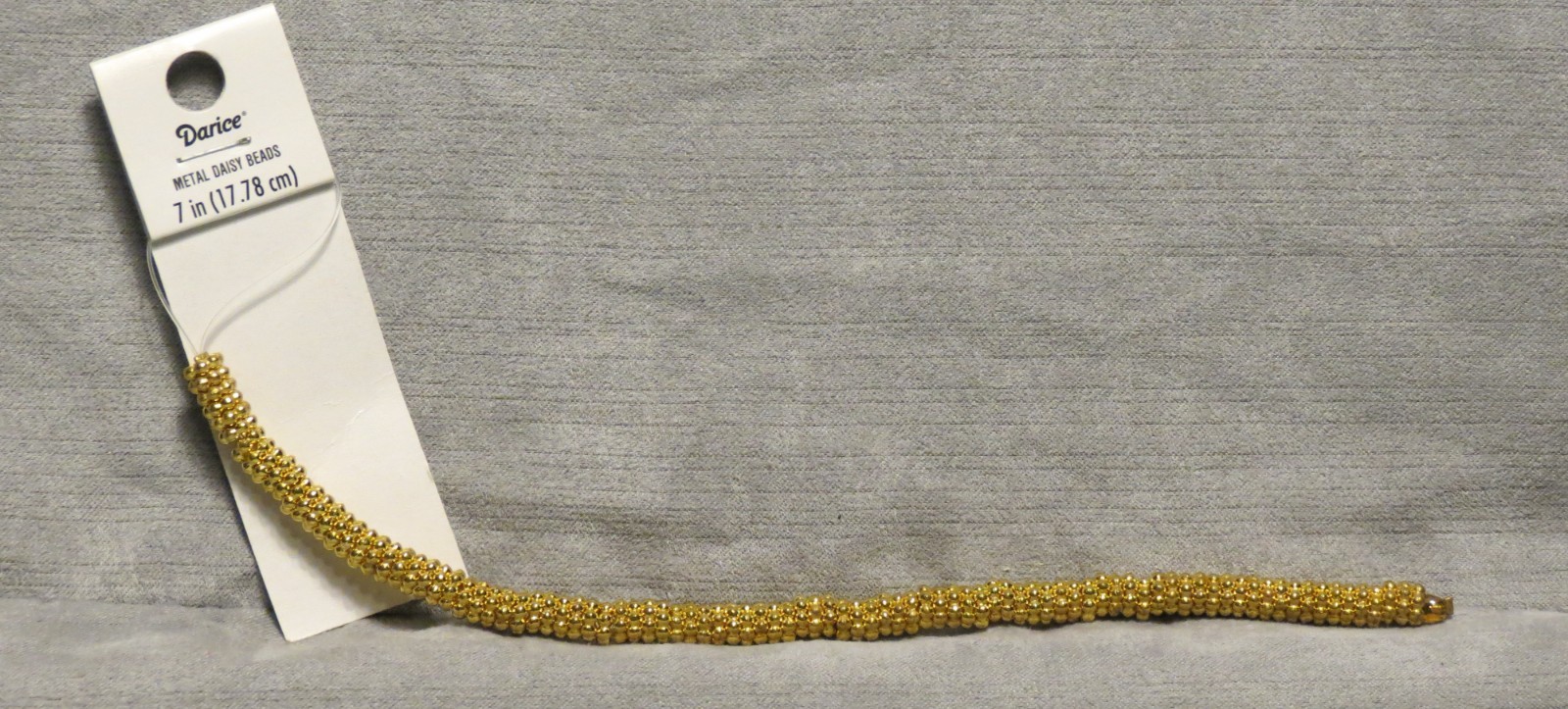 Darice Metal Daisy Beads Gold 6mm, 7″ strand on original card